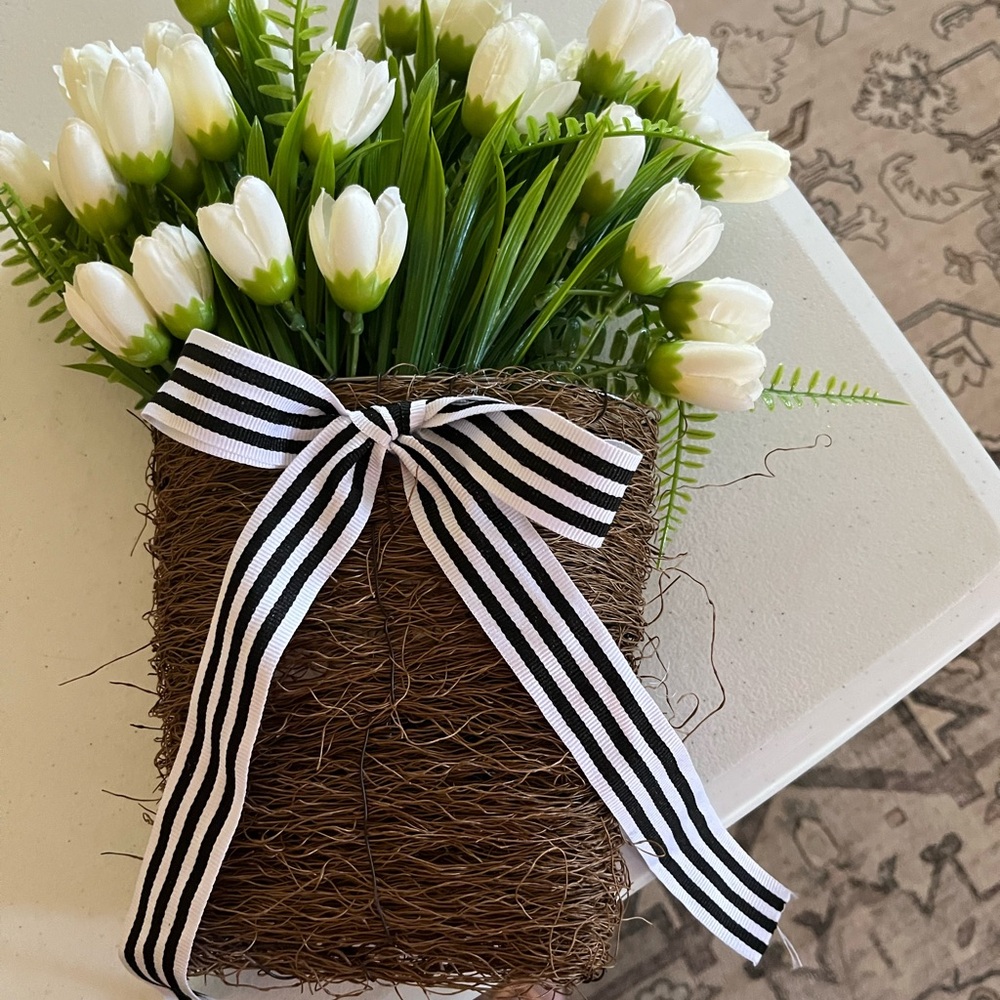 White Tulip Floral Arrangement with Brown Woven Basket and Black-White Ribbon
